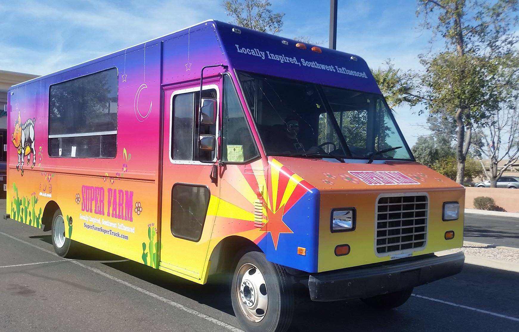 A lively scene from AZ Feastivals showcasing a bustling food truck lineup and vibrant atmosphere.