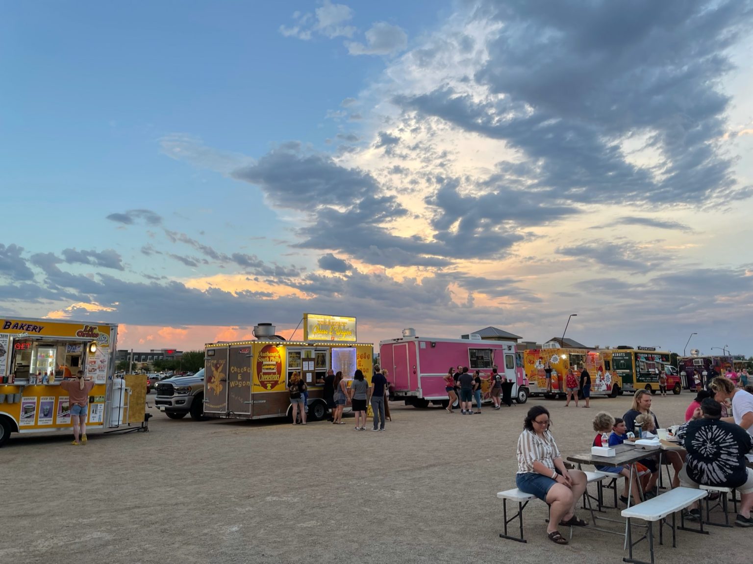 A bustling night at the Queen Creek Feastival, where families gather for diverse culinary delights.
